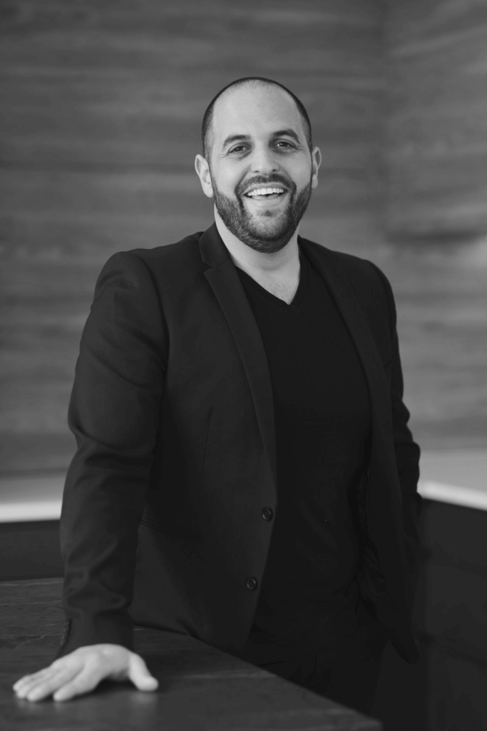 Black-and-white professional portrait of Trendsetter Homes director Michael Agostino.