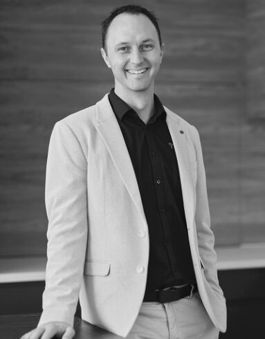 Black-and-white professional portrait of Colin Te Braake, Lead Designer at Trendsetter Homes.