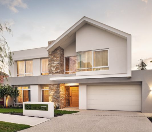 Architectural render of a two-storey custom home featuring pitched rooflines, stone cladding and a landscaped frontage.