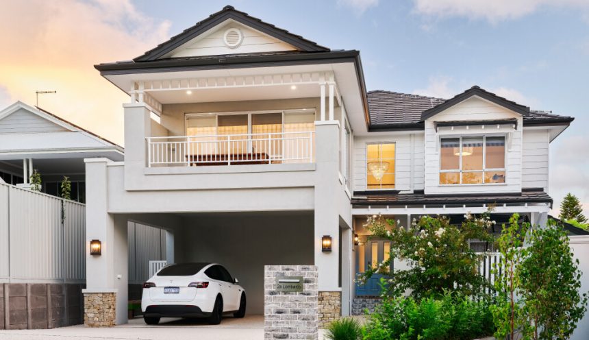 Two-storey custom home on Lombardy Street featuring traditional architectural detailing, weatherboard cladding and a covered balcony.