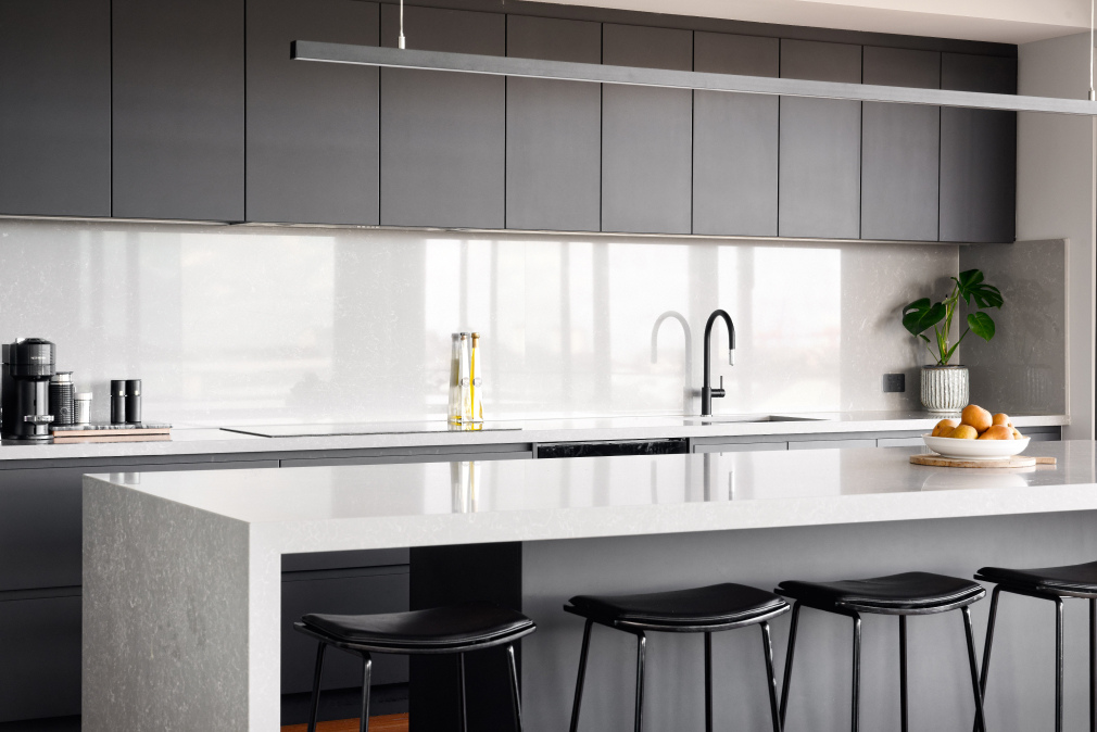 Mathieson Avenue custom home kitchen featuring grey cabinetry, white stone benchtops and minimalist fittings.