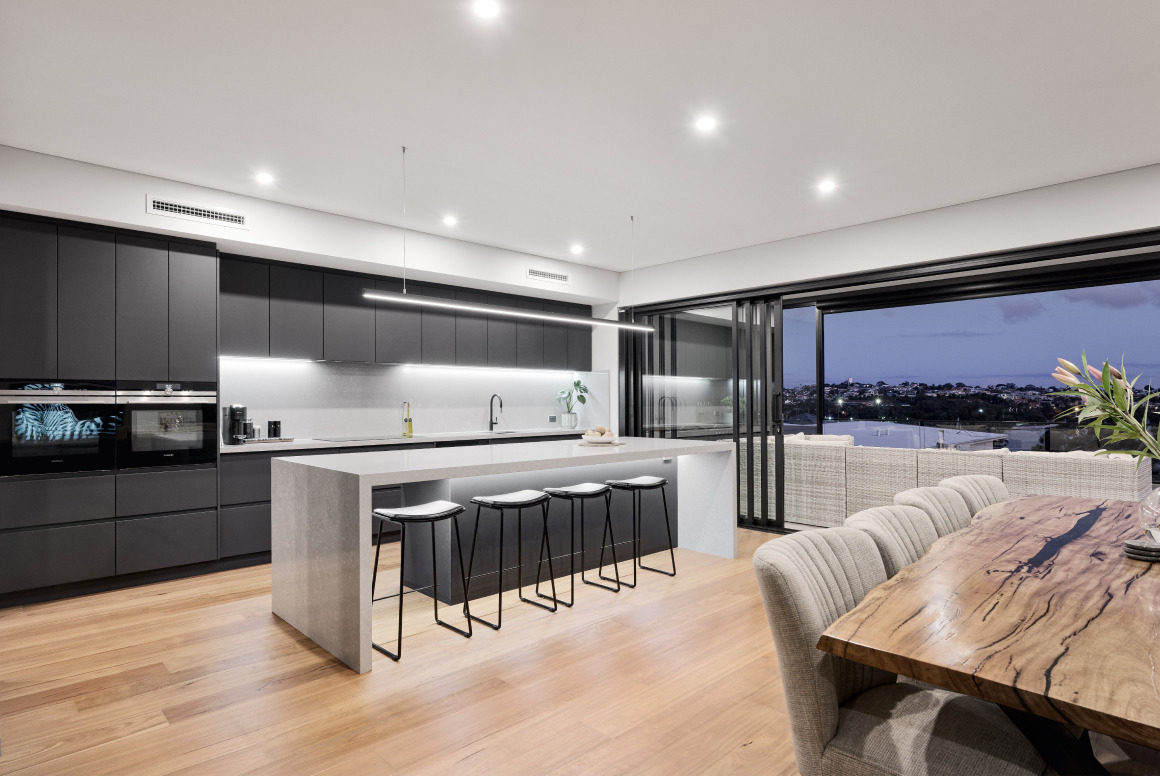 Open-plan living area at the Mathieson Avenue custom home featuring large sliding glass doors connecting to outdoor entertaining.