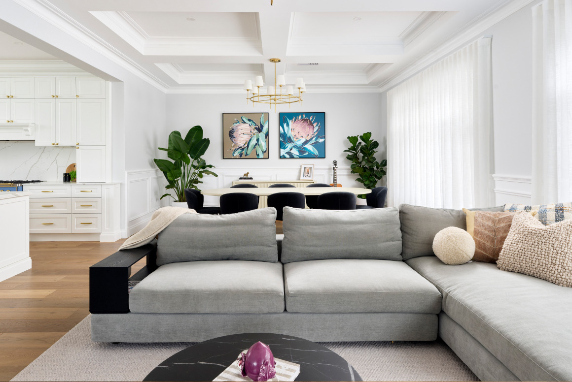 Living and dining area at Lombardy Street featuring contemporary furniture, framed artwork and natural light.