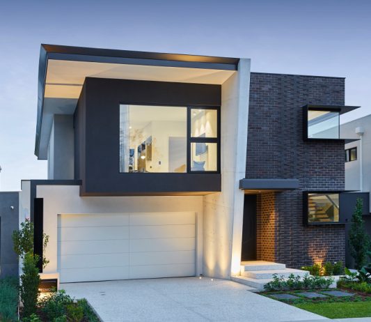 Two-storey custom home at Redmond Street featuring dark exterior cladding, expansive glazing and modern architectural detailing.