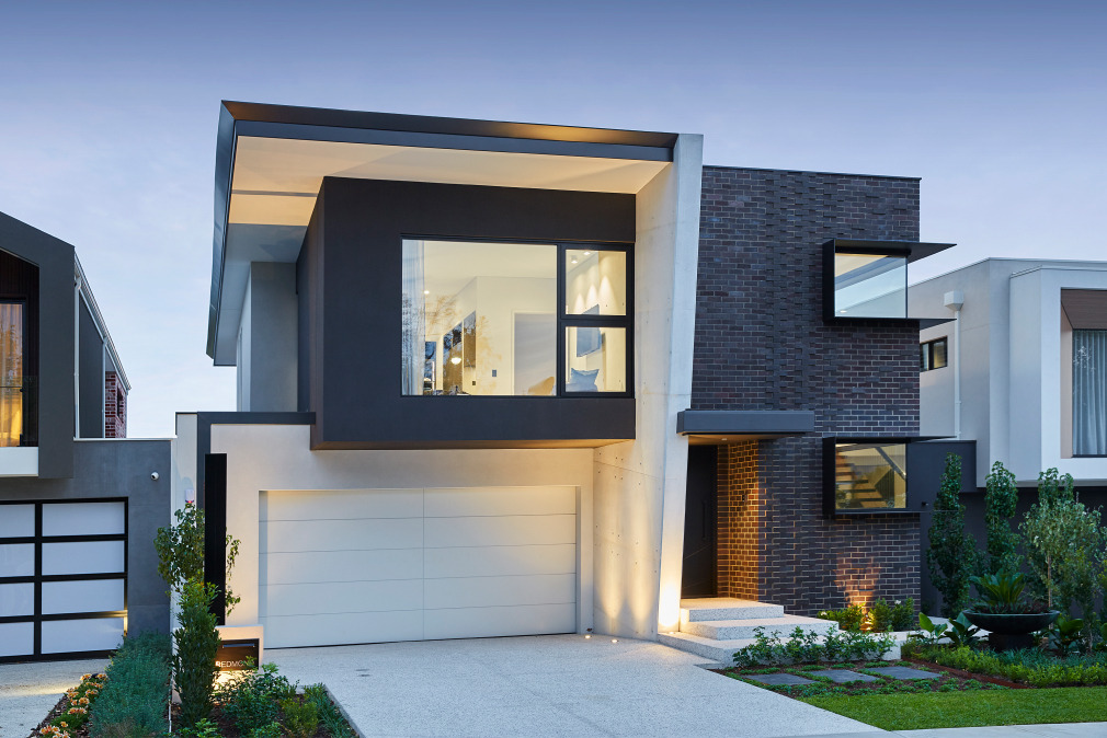 Two-storey custom home at Redmond Street featuring dark exterior cladding, expansive glazing and modern architectural detailing.