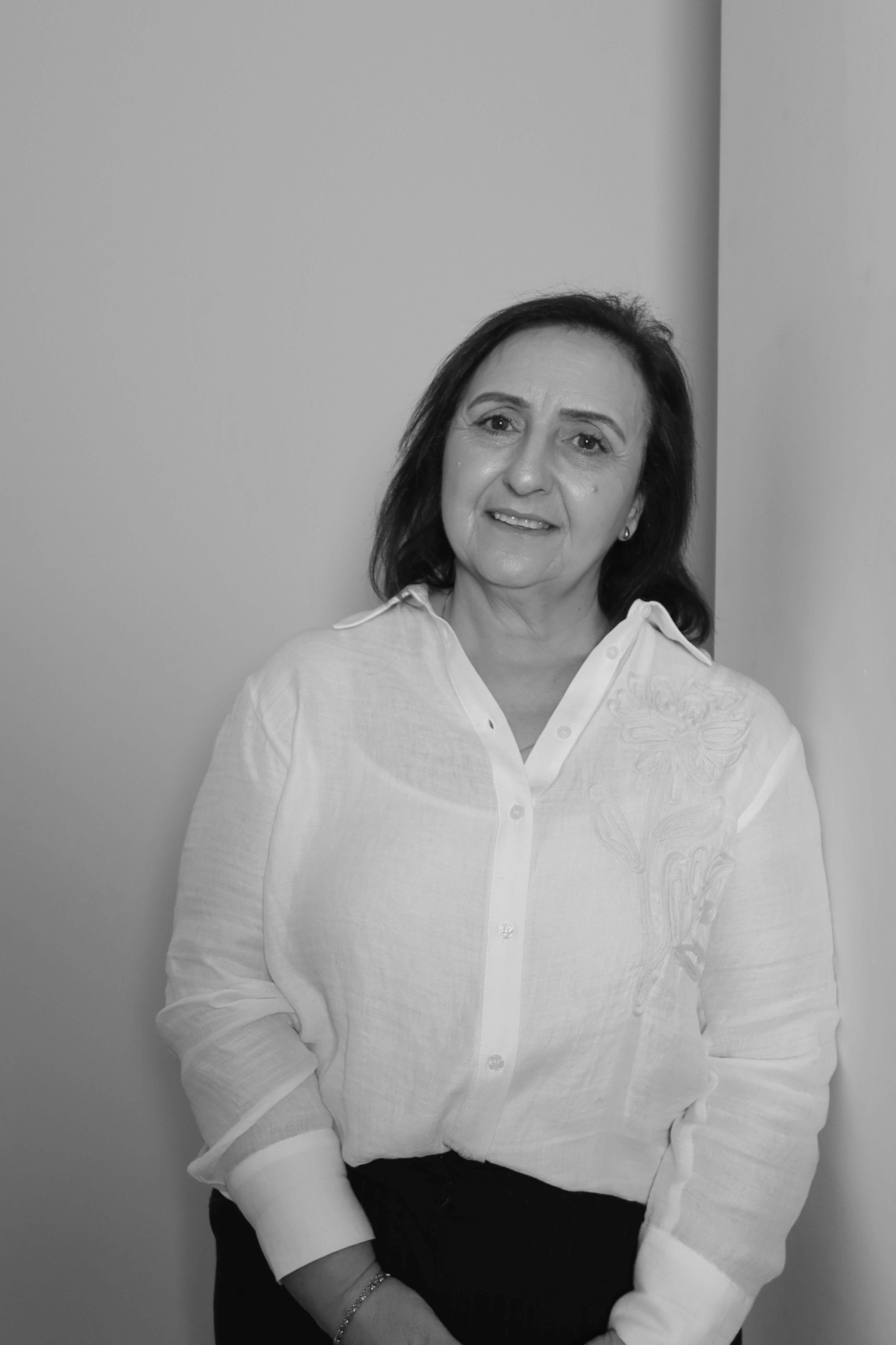 Black-and-white professional portrait of a Finance Manager, Nina Borgomastro of the Trendsetter Homes team.