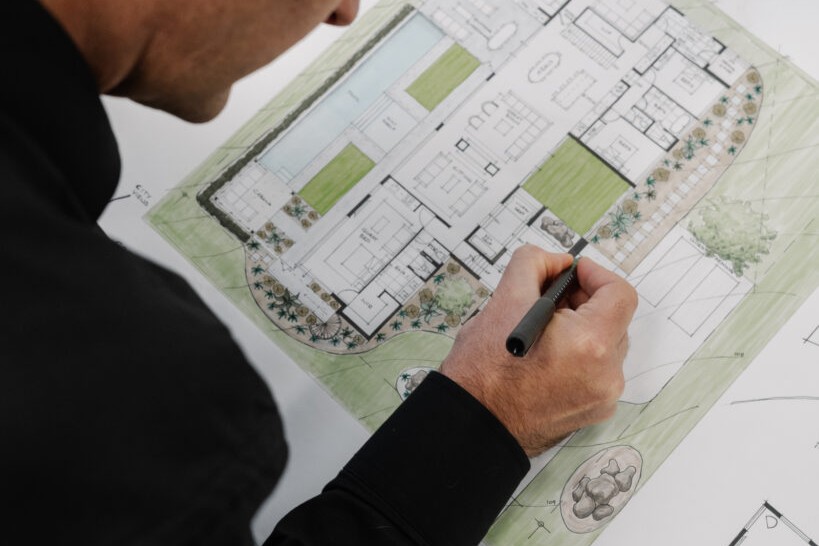 Planner at trendsetter homes in Perth drawing a custom home plan for Perth custom house planning 