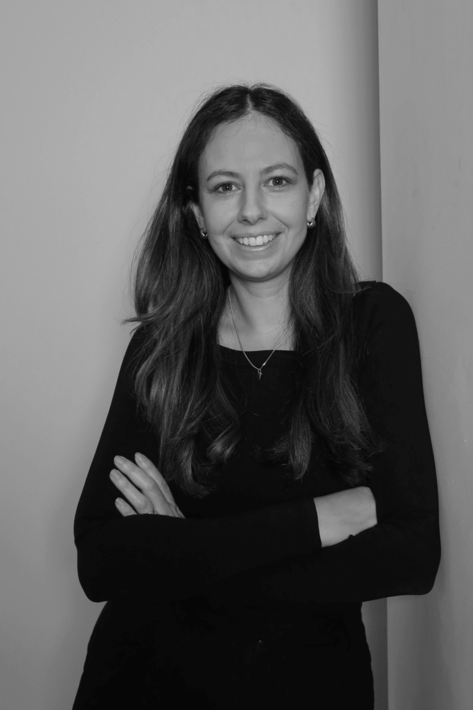 Black-and-white professional portrait of Marketing Specialist, Nina Karimalis from the Trendsetter Homes team.