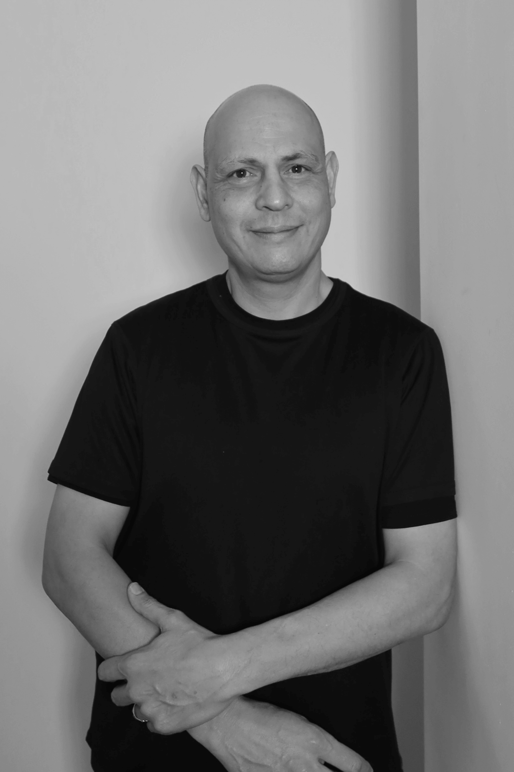 Black-and-white professional portrait of Adam Miliona, Draft Person from the Trendsetter Homes team.