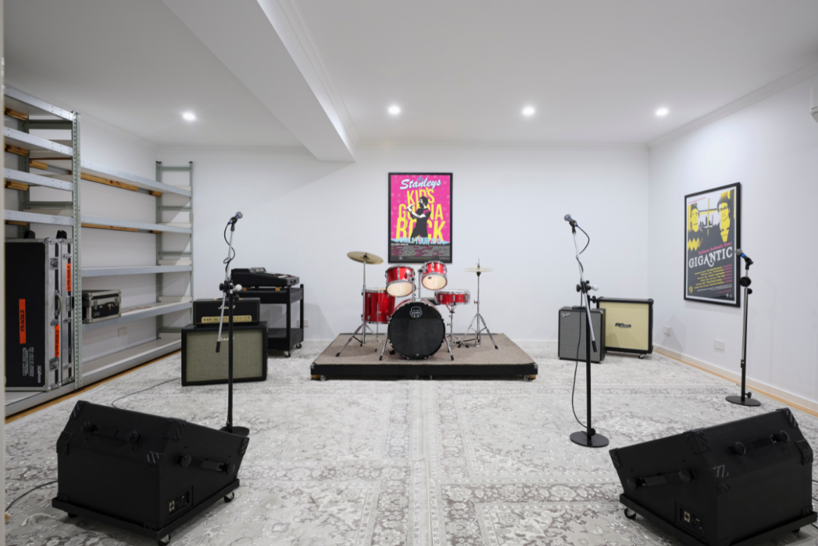 Private home music studio with exercise equipment, built-in storage and recessed ceiling lighting in a Mount Lawley custom home.