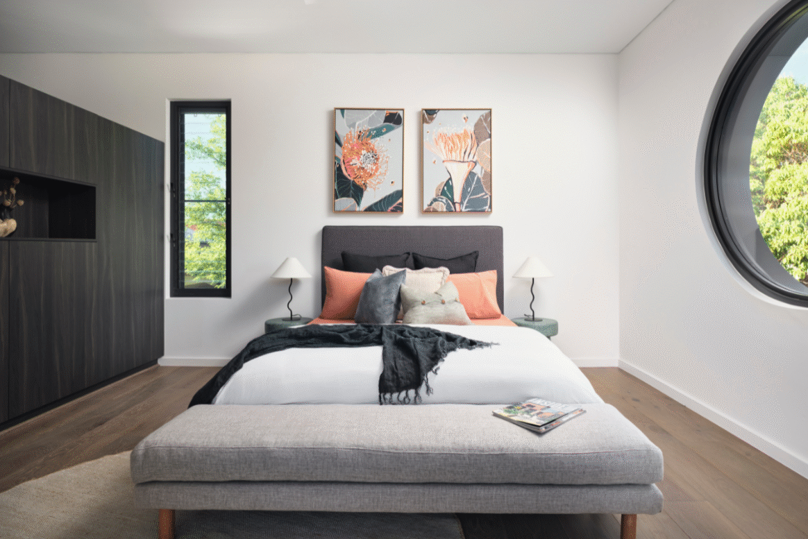Light-filled master bedroom in a Nedlands custom home featuring modern furnishings, artwork and a soft colour palette.