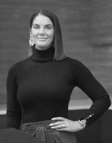Black-and-white portrait of Stef Yujnovich, Interior Designer from the Trendsetter Homes team in Perth.