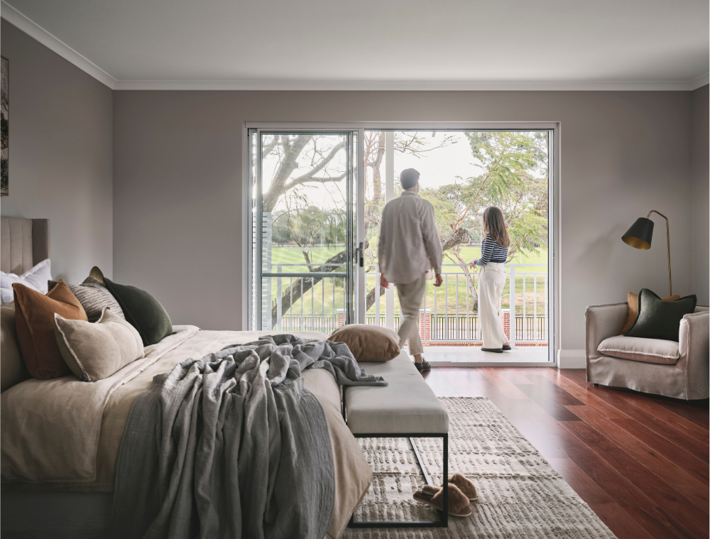 View from the master bedroom towards the balcony and leafy outdoor surroundings in a Mount Lawley home.